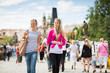 Two female tourists walking along the Charles Bridge