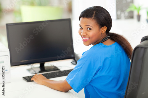 Photo: female black nurse in modern office female black nurse in modern office