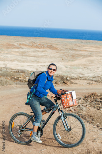 Photo: Woman on the bike on a summer day Woman on the bike on a summer day
