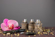 Spa oil on bamboo mat on bright background