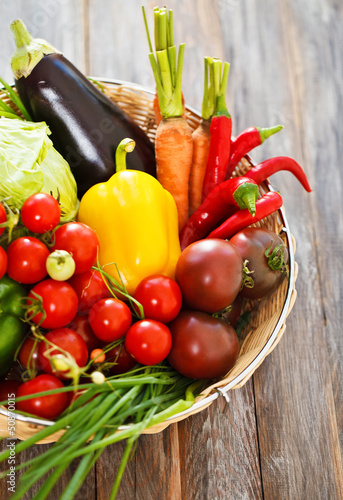 Photo: Vegetables still life on wooden background Vegetables still life on wooden background