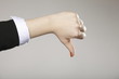 Photo: Female hand signaling thumb down Female hand signaling thumb down