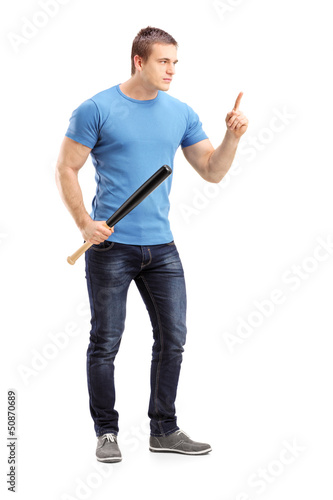 Photo: Full length portrait of a violent young man holding a baseball b Full length portrait of a violent young man holding a baseball b