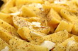 Raw potatoes with spices ready to be roasted
