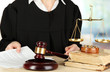 Judge sitting at table during court hearings on room background
