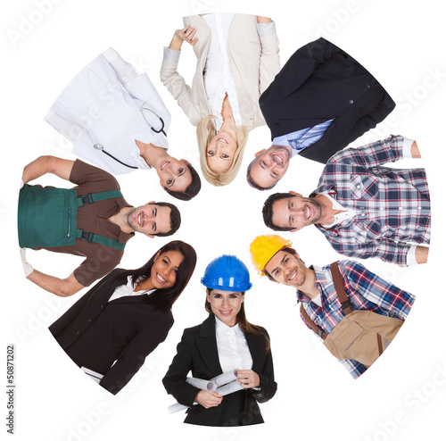Photo: Low angle view of diverse professional group Low angle view of diverse professional group