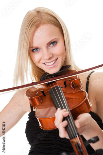 Photo: Beautiful young woman playing violin Beautiful young woman playing violin