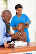 cute african little patient pulling doctor stethoscope