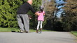 Video: Proud Dad Helps Daughter Ride Scooter-With Helmut Proud Dad Helps Daughter Ride Scooter-With Helmut
