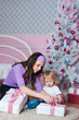 Family at a Christmas fir-tree