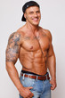 Hot topless guy is smiling on camera