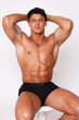 Hot nude guy with hands behind his head
