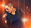 Photo: Hot rocker is singing in microphone Hot rocker is singing in microphone