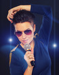 Photo: Stylish singing girl with blue lights Stylish singing girl with blue lights