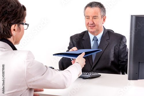 Photo: Businessman and businesswoman discuss business Businessman and businesswoman discuss business