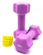 Measuring tape and and Pink dumbbells