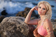 Beautiful woman at sea in swimwear. Blonde girl in at beach