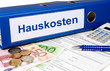 Hauskosten Ordner mit Geld und Taschenrechner