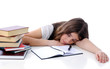 Tired teenager sleeping after learning