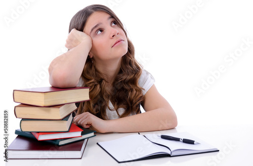 Photo: Teenage girl is thinking under learning time Teenage girl is thinking under learning time