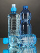 Different water bottles on grey background