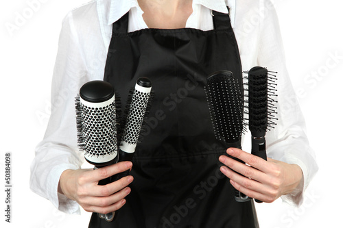 Photo: Hairdresser in uniform with working tools, isolated on white Hairdresser in uniform with working tools, isolated on white
