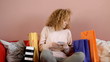 Blond curly hair teenager don't mind about her expenses