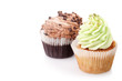 Photo: two cupcakes with cream isolated on white background with copysp two cupcakes with cream isolated on white background with copysp