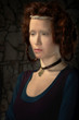 Portrait of redhead woman stylized as old picture