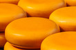 Piles of yellow Dutch cheese on a market
