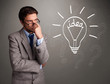 Young boy comming up with a light bulb idea sign