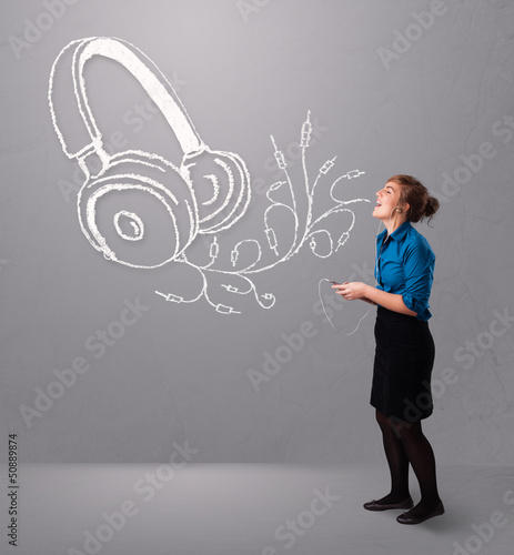 Photo: young woman singing and listening to music with abstract headpho young woman singing and listening to music with abstract headpho