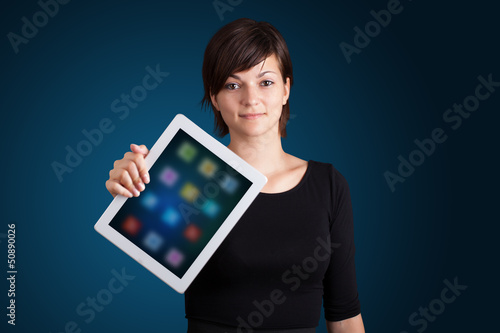 Photo: woman holding modern tablet with colorful icons woman holding modern tablet with colorful icons