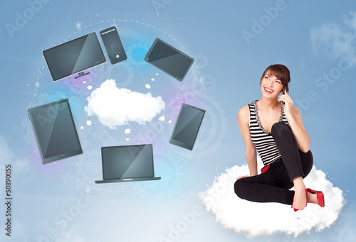 Photo: Young girl sitting on cloud enjoying cloud network service Young girl sitting on cloud enjoying cloud network service