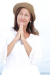 Relaxed mature woman happy praying outdoor