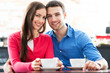 Couple sitting in cafe drinking coffee