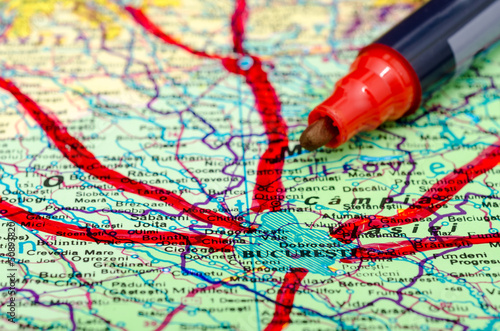 Photo: Marking The Vacation Trips On Map With Red Marker Marking The Vacation Trips On Map With Red Marker