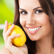Young happy smiling woman with limon, outdoor