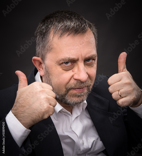 Photo: Successful man shows ok sigh Successful man shows ok sigh