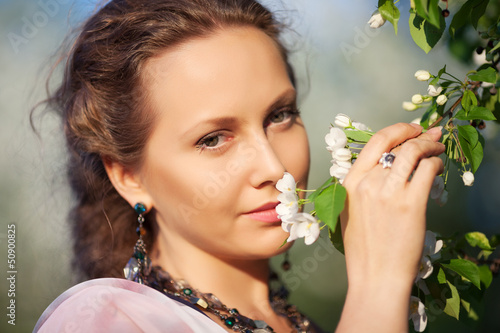 Photo: Beautiful woman in a spring garden Beautiful woman in a spring garden