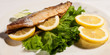 Mackerel Fish And Lemons On Plate