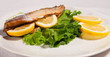 Mackerel Fish And Lemons On Plate