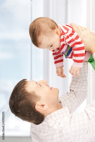 Photo: happy father with adorable baby happy father with adorable baby