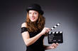Woman with movie clapper board