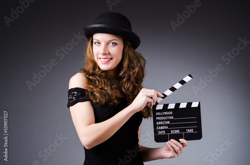 Photo: Woman with movie clapper board Woman with movie clapper board