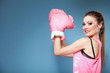 Female boxer model with big fun pink gloves