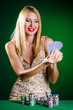 Woman in casino playing cards