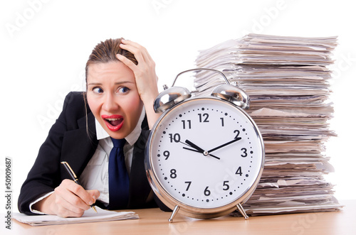 Photo: Woman businesswoman with giant alarm clock Woman businesswoman with giant alarm clock