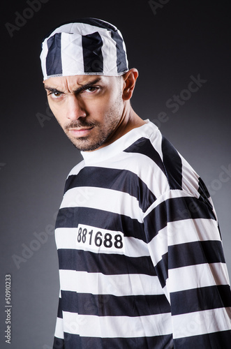 Photo: Convict criminal in striped uniform Convict criminal in striped uniform