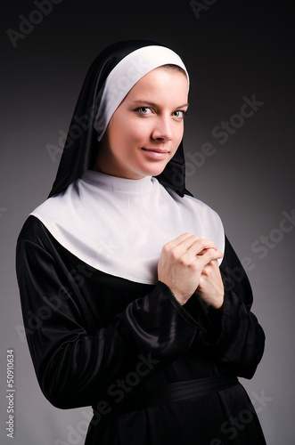 Photo: Young nun in religious concept Young nun in religious concept